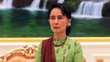 (FILES) In this file photo taken on May 22, 2018, Myanmar's State Counsellor Aung San Suu Kyi waits to greet Wang Zhengwei, vice chairperson of the Chinese People's Political Consultative Conference (CPPCC), in Naypyidaw. Ousted Myanmar leader Aung San Suu Kyi will hear the first testimony against her in a junta court on June 14, 2021, more than four months after a military coup.