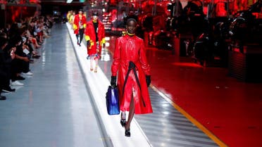 Models present outfits from luxury carmaker Ferrari's first internally-designed fashion collection for women and men as the first step of its rebooted brand extension strategy, in Maranello, Italy, June 13, 2021. (Reuters/Remo Casilli)