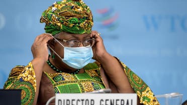 New Director-General of the World Trade Organisation Ngozi Okonjo-Iweala adjusts her face mask as a preventive measure against the COVID-19 coronavirus disease during a session of the WTO General Council upon her arrival at the WTO headquarters to take an office in Geneva, Switzerland March 1, 2021. (Reuters)