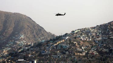 A NATO helicopter flies over the city of Kabul, Afghanistan June 29. 2020. (Reuters)