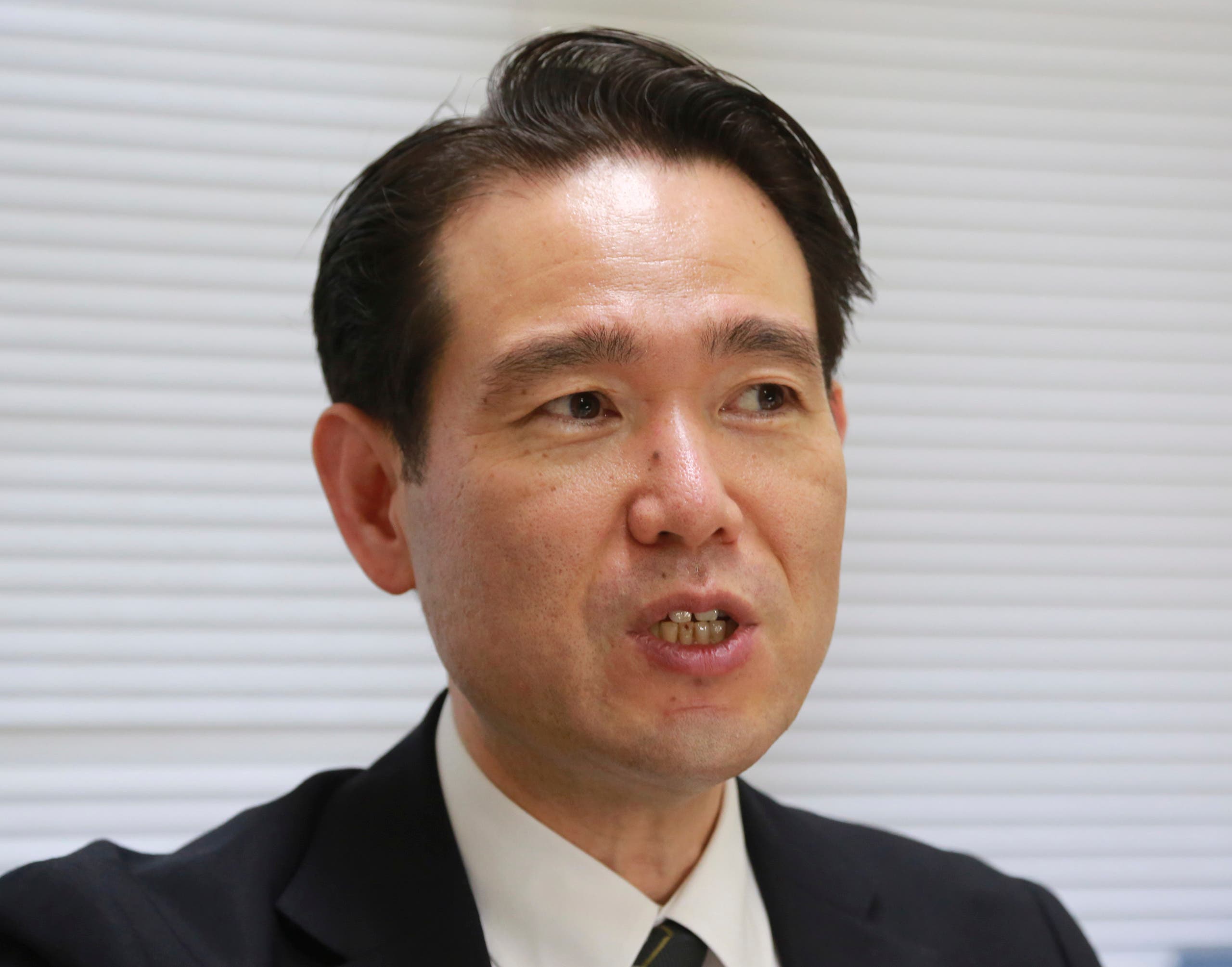 Professor Hiroaki Takazawa of Nihon University, speaks during an interview with the Associated Press in Chiba, near Tokyo on June 8, 2021. Takazawa has revealed declassified documents showing executed wartime Japanese Prime Minister Hideki Tojo's cremated ashes were scattered from a U.S. army aircraft over the Pacific Ocean about 30 miles (50 kilometers) east of Yokohama, Japan's second largest city. (File photo: AP)