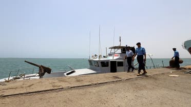 Yemeni local coast guards walk after being deployed at Hodeidah port in Hodeidah, Yemen. (Reuters)