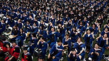This photo taken on June 13, 2021 shows nearly 11,000 graduates, including more than 2000 students who could not attend the graduation ceremony last year due to the COVID-19 coronavirus outbreak, attending a graduation ceremony at Central China Normal University in Wuhan, in China's central Hubei province. (AFP)