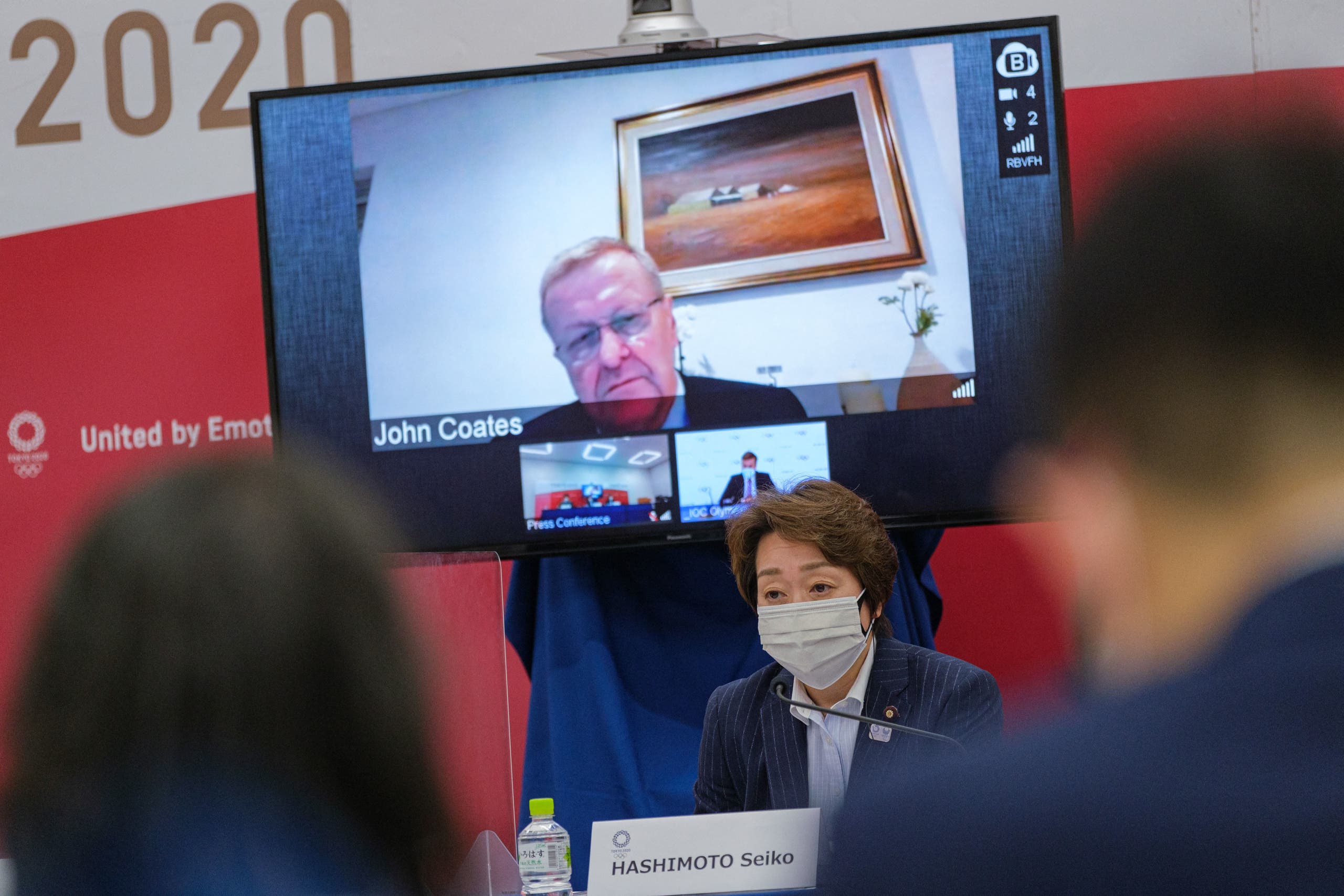 Tokyo 2020 CEO Toshiro Muto (L), Tokyo 2020 Olympics organising committee president Seiko Hashimoto (R) and International Olympic Committee (IOC) vice president John Coates (on screen) attend a Tokyo 2020 IOC Coordination Commission press conference in Tokyo on May 21, 2021. (File photo: AFP)