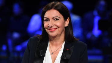 Socialist party's outgoing mayor and candidate Anne Hidalgo arrives on set prior to a debate between seven of the eight candidates running for Paris' city mayor, broadcasted by French public TV and radio news outlet France Info, public TV channel France 3 and public radio station France Bleu Paris, in Paris, March 10, 2020. (Reuters)