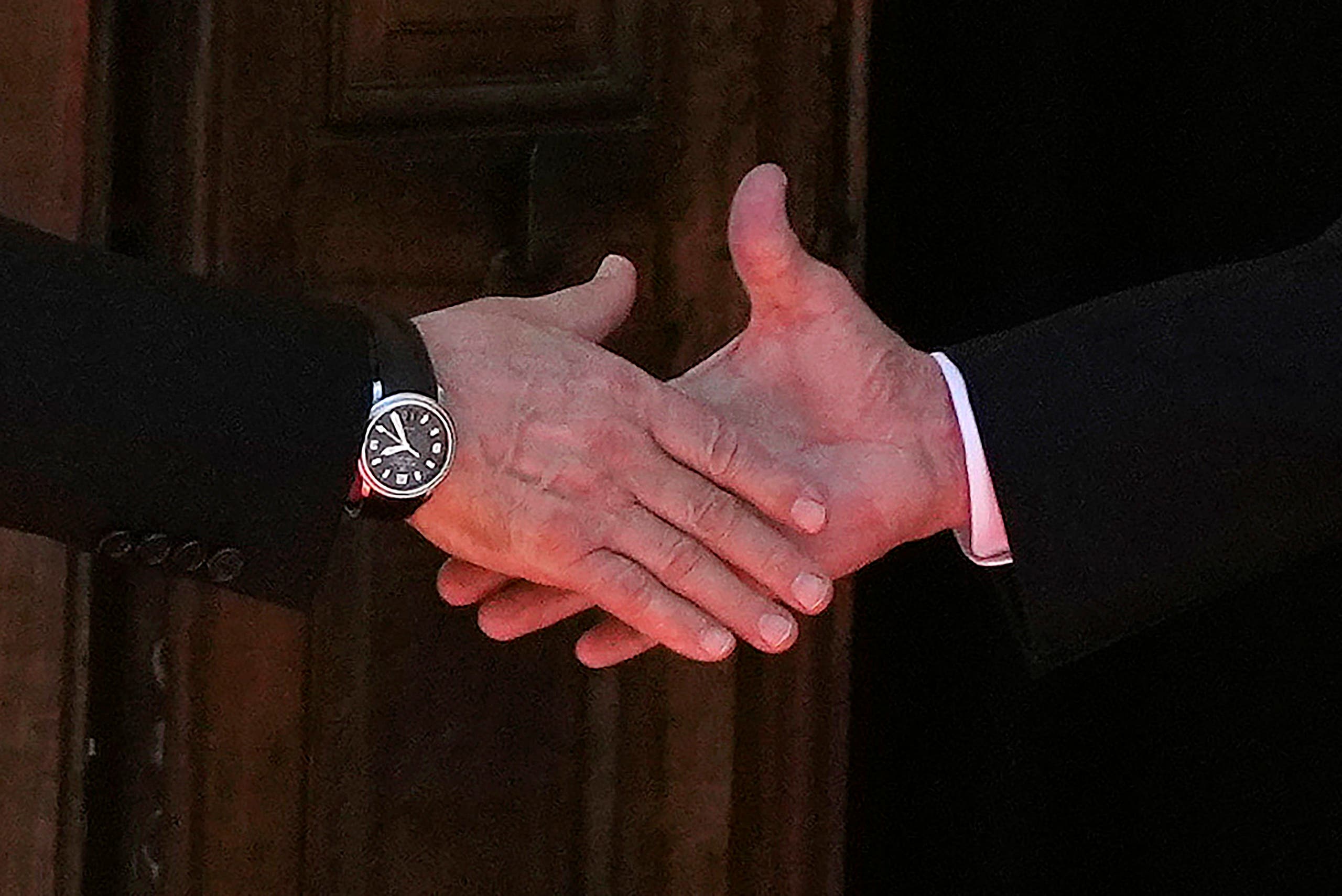 A handshake between Putin and Biden at their first meeting in Geneva since the US presidential election