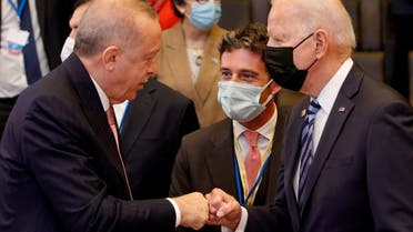Turkey's President Tayyip Erdogan fist bumps President Joe Biden in Brussels, June 14, 2021. (Reuters)