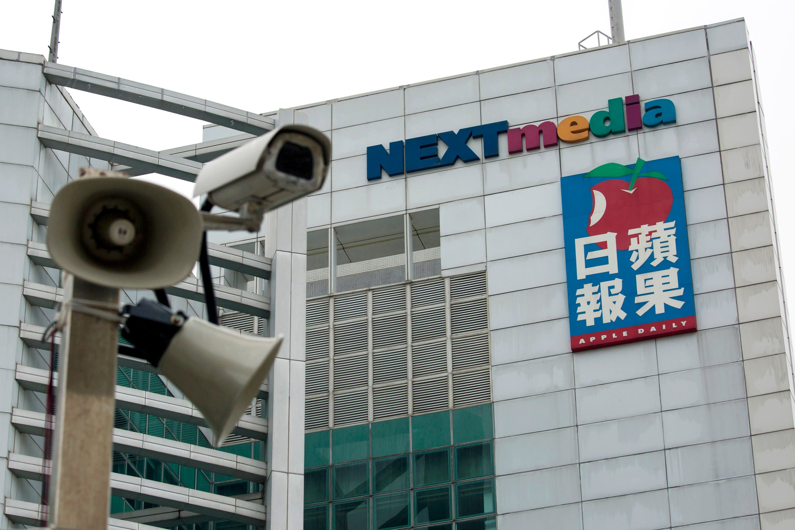 A security camera is seen in front of the headquarters of Apple Daily and Next Media in Hong Kong January 12, 2015. 
