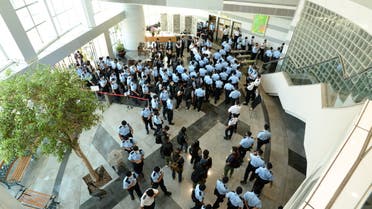 Police officers gather at the headquarters of Apple Daily in Hong Kong, China June 17, 2021. Apple Daily/Handout via REUTERS ATTENTION EDITORS - THIS IMAGE WAS PROVIDED BY A THIRD PARTY. NO RESALES. NO ARCHIVES. HONG KONG OUT. TAIWAN OUT.
