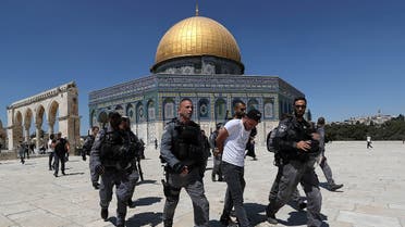 Israeli security force members detain a Palestinian during clashes at the compound that houses Al-Aqsa Mosque, known to Muslims as Noble Sanctuary and to Jews as Temple Mount, in Jerusalem's Old City, on June 18, 2021. (Reuters)