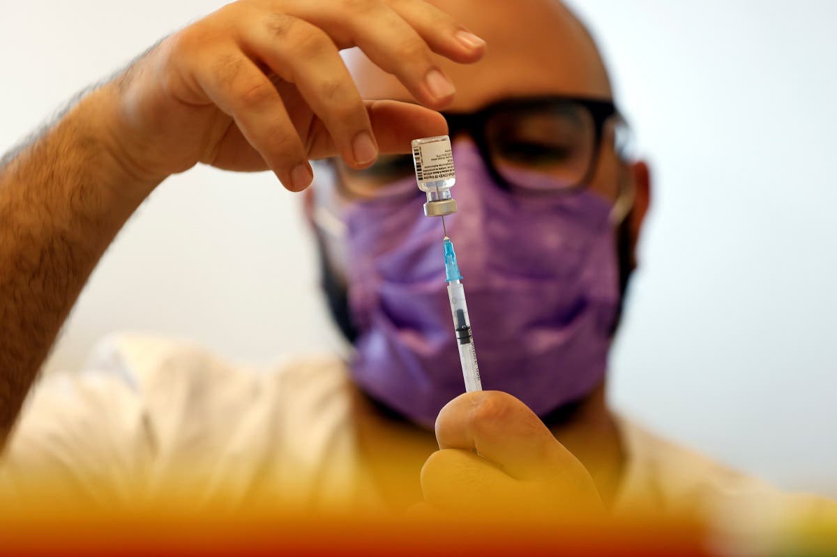 A medical worker prepares a vaccination against the coronavirus disease (COVID-19) after Israel approved the usage of the vaccine for youngsters aged 12-15, at a Clalit healthcare maintenance organisation in Ashkelon, Israel. (Reuters)