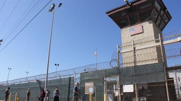 In this file photo taken on January 26, 2017, People walk past the guard tower of Camp 5 at the US Military's Prison in Guantanamo Bay, Cuba. (AFP)