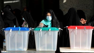 Voters cast their ballots for the presidential election at a polling station in Tehran, Iran, Friday, June 18, 2021. (AP)