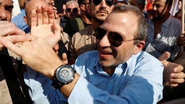 Lebanese MP Gebran Bassil greets his supporters during a rally near Beirut, November 3, 2019. (Reuters)