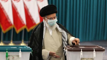 Iran’s Supreme Leader Ayatollah Ali Khamenei wears a face mask as he casts his ballot on June 18, 2021, on the day of the Islamic republic’s presidential election. (AFP)