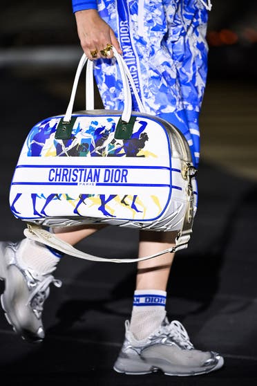 A model presents a creation for Dior during the 2022 Dior Croisiere (Cruise) fashion show, at the Panathenaic Stadium, in Athens, on June 17, 2021. (AFP)