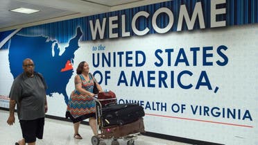 Passengers arrive to the Washington Dulles International Airport. (File Photo: AP)