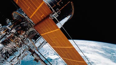  In this April 25, 1990 file photo provided by NASA, most of the giant Hubble Space Telescope can be seen as it is suspended in space by Discovery's Remote Manipulator System (RMS) following the deployment of part of its solar panels and antennae. (AP)