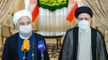 A handout picture provided by the Iranian presidency on June 19, 2021, shows outgoing President Hassan Rouhani (L) taking in part in a press conference with President-elect Ebrahim Raisi (R) during his visit to congratulate the ultraconservative cleric on winning the presidential election. Ebrahim Raisi was declared the winner Saturday of Iran's presidential election, a widely anticipated result after many political heavyweights were barred from running.