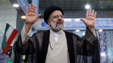 Presidential candidate Ebrahim Raisi gestures after casting his vote during presidential elections at a polling station in Tehran, Iran June 18, 2021. (Reuters)