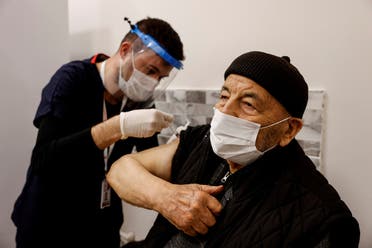 Hasan Oz receives a shot of the Sinovac's CoronaVac COVID-19 vaccine as nationwide vaccination began for seniors of 80 years old or older at Sancaktepe Education and Research Hospital, in Istanbul, Turkey, January 27, 2021. (Reuters)