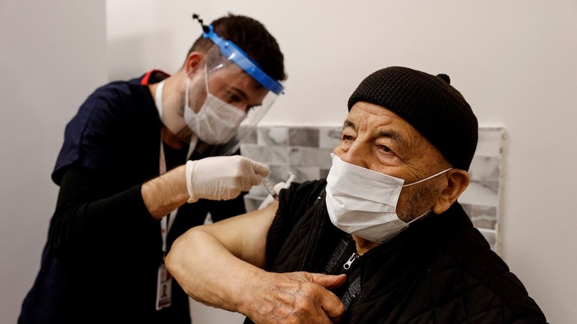 Hasan Oz receives a shot of the Sinovac's CoronaVac COVID-19 vaccine as nationwide vaccination began for seniors of 80 years old or older at Sancaktepe Education and Research Hospital, in Istanbul, Turkey, January 27, 2021. (Reuters)