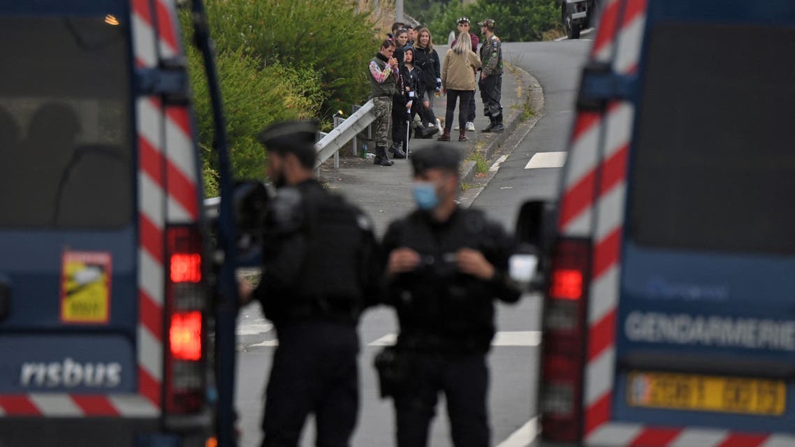French gendarmes stand on a road, in Redon, north-western France, on June 19, 2021, as they intervene to prevent an illegal rave party, which began during the night of June 18 to June 19, 2021. Five gendarmes were injured during the intervention to disperse an illegal rave party in Redon (Ille-et-Vilaine) and a young participant of 22 years old lost a hand, announced on June 19, 2021 morning the prefect of Ille-et-Vilaine Emmanuel Berthier. The police has been confronted with violent individuals who refuse to leave the premises for several hours, he said on June 19, 2021.