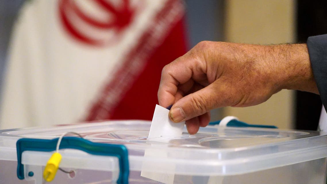 An Iranian man living in Iraq votes for presidential election, at a polling station in the Iraqi Shiite holy city of Najaf, on June 18, 2021.