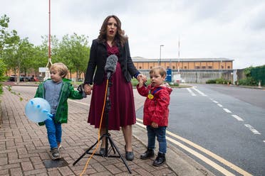 Stella Moris stands with her children Gabriel, four, left, and Max, two, as she speaks to the media, outside Belmarsh Prison, following a visit to her partner and their father Julian Assange in London, Saturday June 19, 2021. (Dominic Lipinski/PA via AP)