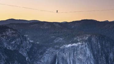 In this Saturday, June 12, 2021, photo provided by Scott Oller Films, highliner Daniel Monterrubio walks the 2,800-foot-long line off Taft Point above Yosemite Valley in Yosemite, Calif. (Scott Oller/Scott Oller Films via AP)Scott Oller/AP