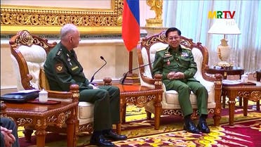 This screengrab taken on March 26, 2021 shows Russia’s Deputy Defense Minister Alexander Fomin (L) meeting Min Aung Hlaing in Naypyidaw. (Handout/AFPTV/Myanmar Radio and Television/AFP)