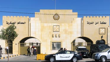 A police vehicle is parked outside the military court where the trial of former royal court chief Bassem Awadallah and a minor royal, Sherif Hassan Zaid, is set to take place in Amman, Jordan June 21, 2021. (Reuters)