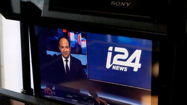Swiss-Israeli CEO of the international television station i24 News, Frank Melloul, is pictured on a monitor at the station's headquarters in Tel Aviv's waterfront Jaffa district on October 16, 2018. The TV station said it started transmitting in English and French inside Israel itself in August 2018, after finally winning a local broadcast licence, five years after its launch. (AFP)