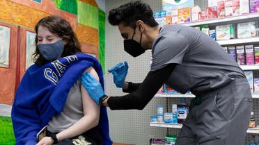 Julia Gadsby, 18, who has Lupus, receives the Pfizer-BioNTech vaccine against the coronavirus disease at Skippack Pharmacy in Schwenksville, Pennsylvania, US. (Reuters)