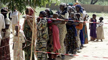 Nigerois women and their malnourished children wait in line 24 August 2005 at the entrance of a Medecins Sans Frontieres (Doctors without Borders) center in Dogo, near Zinder. (Issouf Sanogo/AFP)