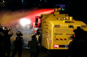 Israeli security forces spray Palestinians with skunk water in the east Jerusalem neighbourhood of Sheikh Jarrah on June 21, 2021. (AFP)