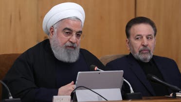 A handout picture provided by the Iranian presidency shows the Islamic republic's President Hassan Rouhani (L) chairing a cabinet meeting in the presence of his chief of staff Mahmoud Vaezi in Tehran on January 8, 2020. (Iranian Presidency/AFP)