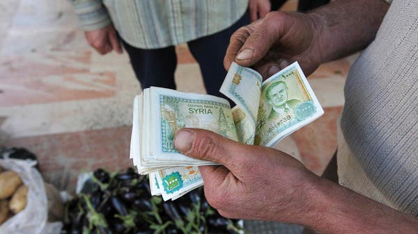 The Central Bank of Syria sets a new exchange rate for the pound against the dollar