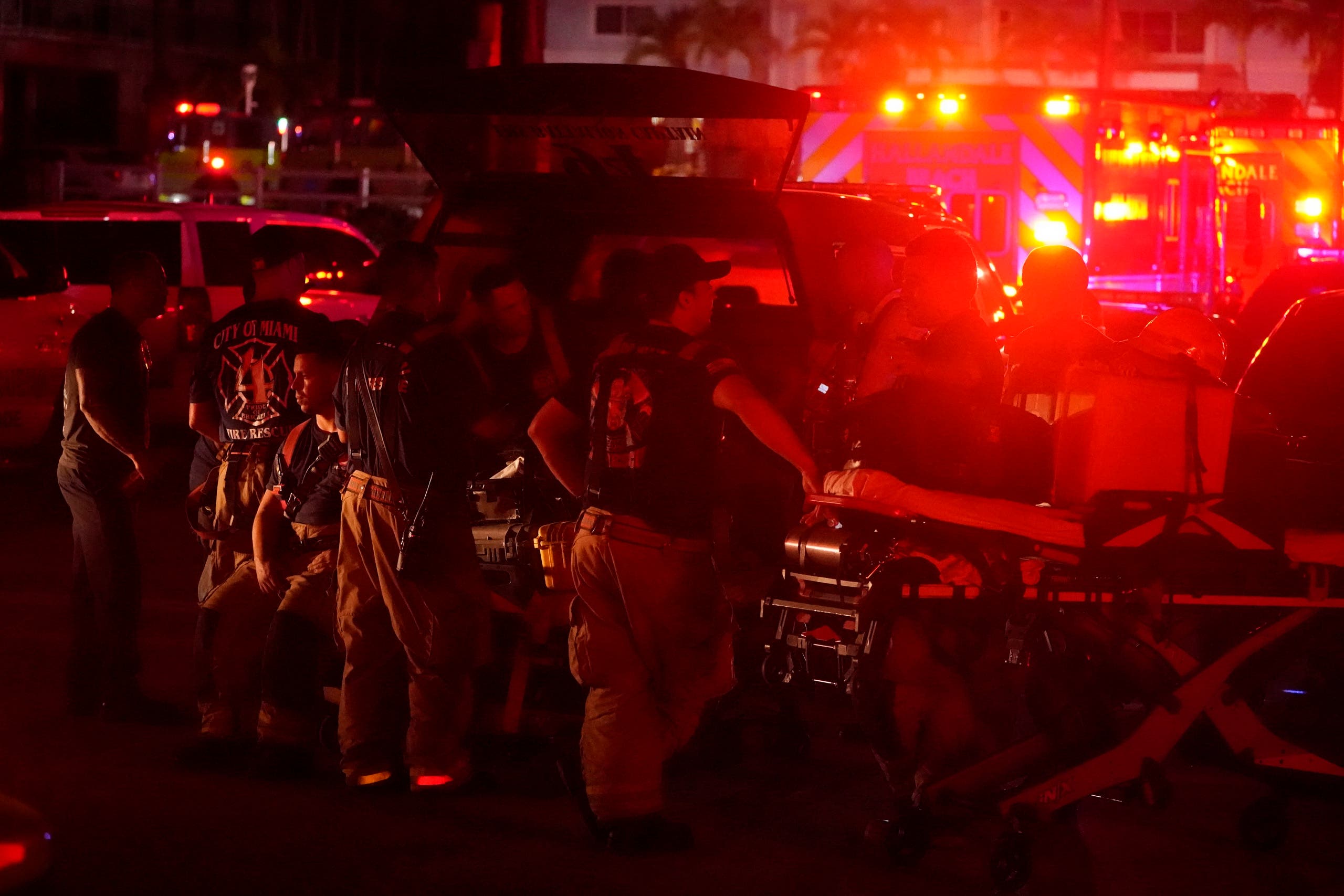 Firefighters standby after a partial collapse of a building, Thursday, June 24, 2021, in the Surfside area of Miami, Florida. (AP)