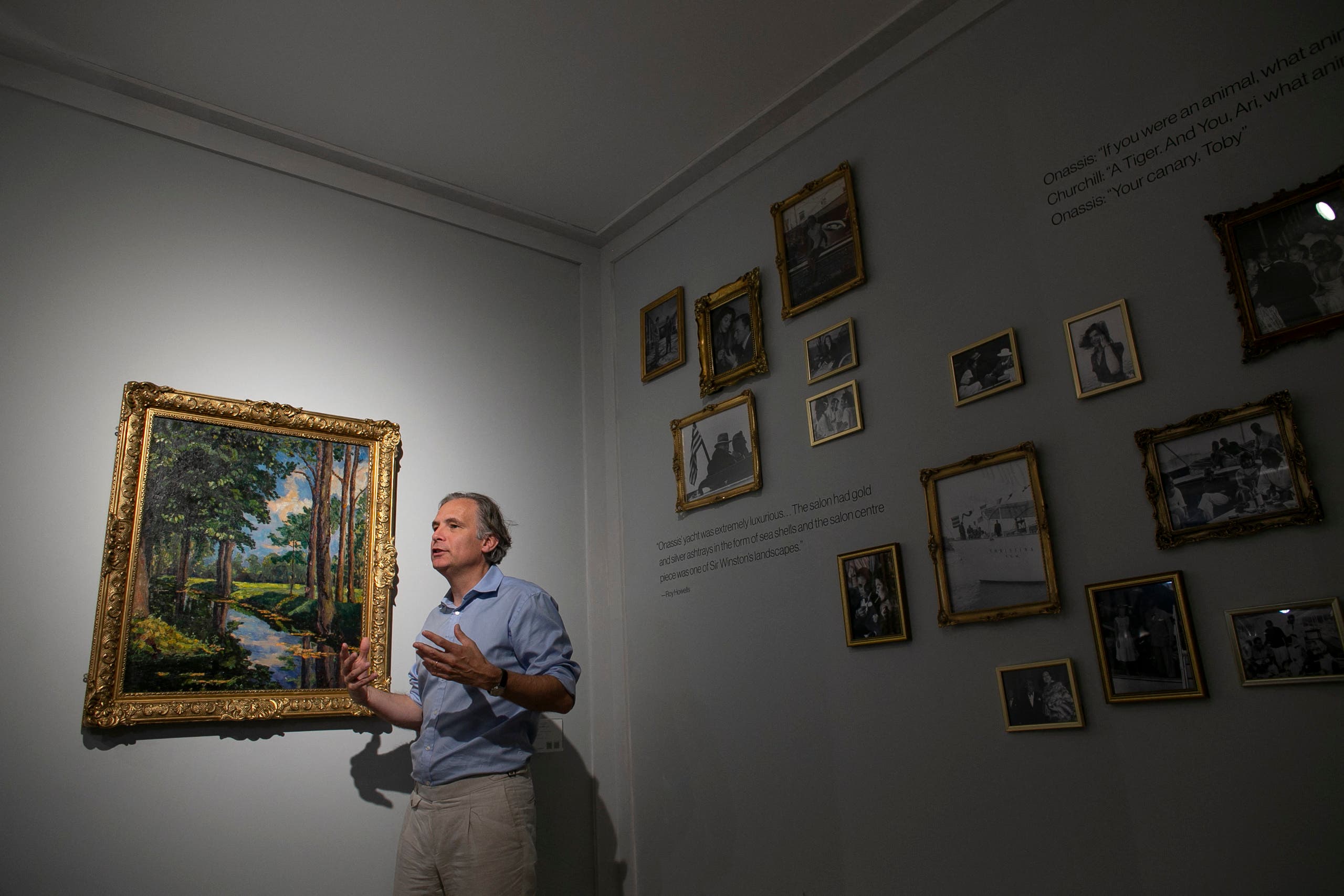 Jean Paul Engelen, Deputy Chairman and worldwide co-head of 20th century and contemporary art at Phillips Auction House speaks next to The Moat, Breccles painting made by Winston Churchill and owned by the Onassis family, in New York. (AFP)