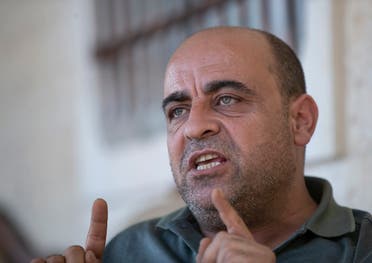 Nizar Banat, an outspoken of the Palestinian Authority, speaks to journalists at the family house, in the West Bank city of Hebron, May 4, 2021. (AP)