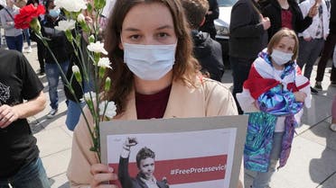 Protesters wear traditional Belarusian flags as Belarusians living in Poland and Poles take part in a demonstration demanding freedom for Belarus opposition activist Roman Protasevich, on Castle Square in Warsaw, Poland. (File photo: AP)