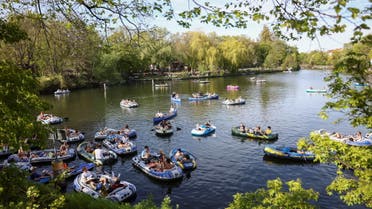 People ride on boats as they enjoy the sunny weather on the Landwehrkanal, as the spread of the coronavirus disease (COVID-19) continues, in Berlin, Germany, May 9, 2021. REUTERS/Christian Mang
