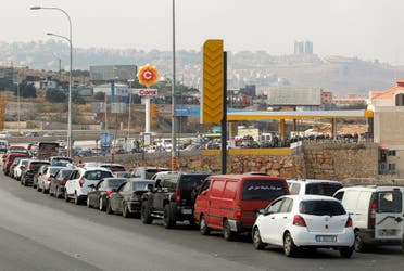 Cars stand in line at a gas station as they wait to fuel up in Damour, Lebanon June 25, 2021. (Reuters)