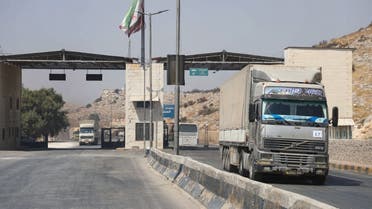 International humanitarian aid trucks cross into Syria’s northwestern Idlib province through the Bab al-Hawa border crossing with Turkey, on September 7, 2020. (Aaref Watad/AFP)