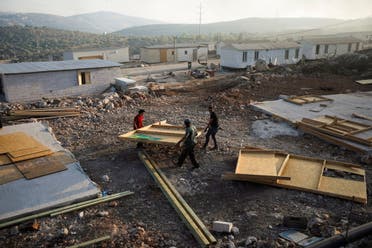 Jewish settlers construct a structure in Givat Eviatar, a new Israeli settler outpost, near the Palestinian village of Beita in the Israeli-occupied West Bank June 23, 2021. Picture taken June 23, 2021. (Reuters)