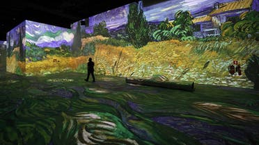 Visitors look at projected paintings and drawings at the Van Gogh exhibit produced by Culturespaces and directed by Gianfranco Iannuzzi, Renato Gatto, and Massimiliano Siccardi, during a preview of the digital exhibition titled Infinity des Lumieres in Dubai, in the United Arab Emirates, on June 28 , 2021. (AFP)