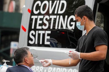 A man receives a coronavirus disease test at a mobile testing van in Brooklyn, New York, US, June 2, 2021. (Reuters/Brendan McDermid)