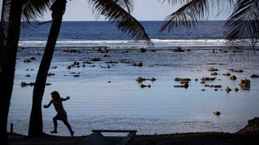  A child plays near the beach in Nauru during the Pacific Islands Forum on the tiny Pacific nation of Nauru Monday, Sept. 3, 2018. The Pacific Islands Forum conference starts in Nauru on Monday night. The forum brings together 18 members including Australia and New Zealand to discuss regional issues. (AP)