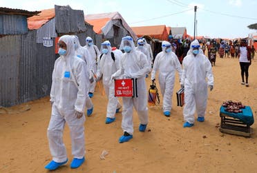 Members of Somali First Aid Association (SOFA) arrive to spray disinfectants in an effort to stop the spread of the coronavirus disease (COVID-19) at a camp for the internally displaced people in Mogadishu, Somalia April 18, 2021. (Reuters)